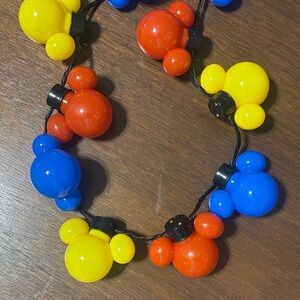 Disneyland Resort Mickey Mouse Glow Necklace. New with tags. Red, blue, yellow
